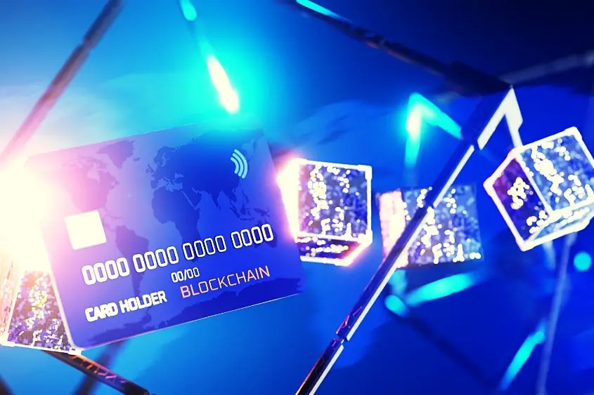 NFT Picture of a credit card with the words blockchain on it. Most NFT transaction occur on the blockchain.