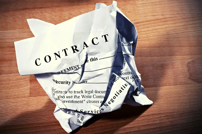 A crumpled up paper contract