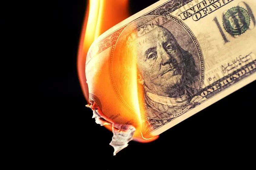 A 100 dollar bill on fire