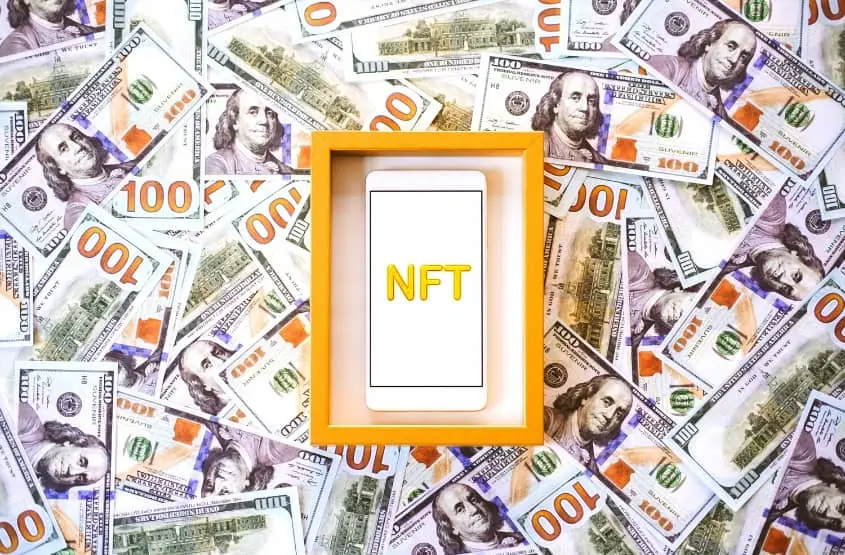 An NFT framed and surrounded by money.