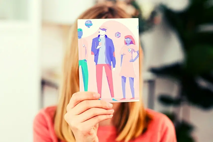 POAP. A woman holding up a picture with people viewing their POAPs.