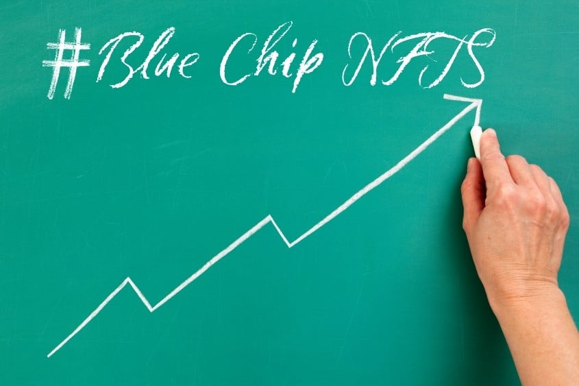 Bluechip NFT. A chalkboard with blue chip nft and an up arrow on it.