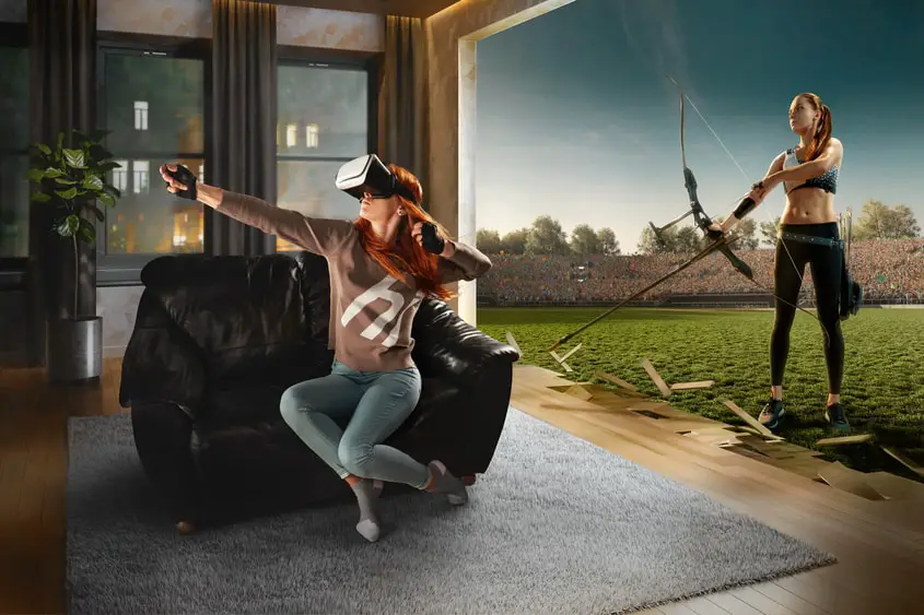 A woman playing a game in a virtual enviroment via the metaverse.