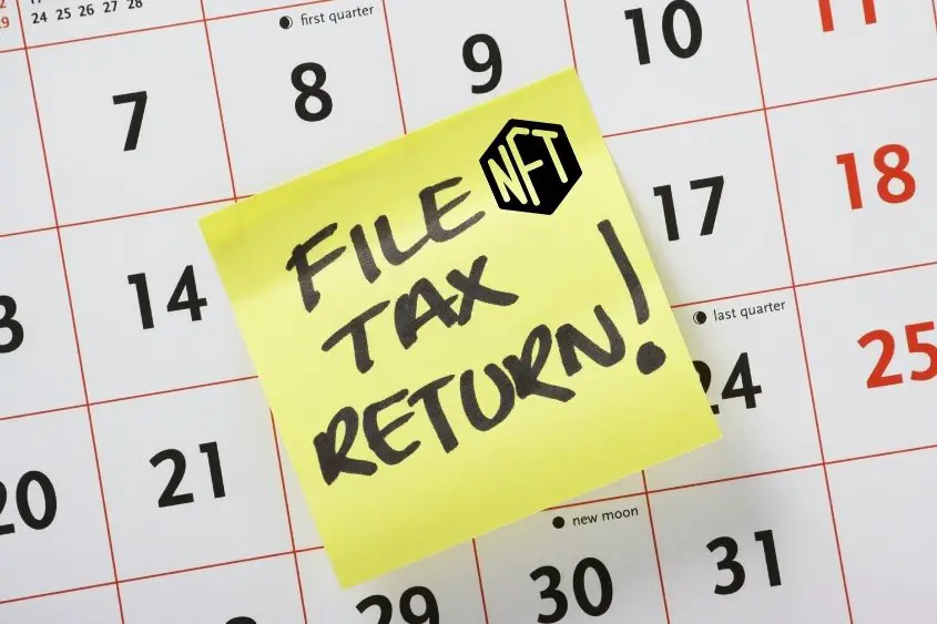 NFT taxes. A sticky note saying file tax return posted on a calendar.