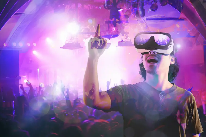 A person at a concert in the metaverse. Entertainment looks different in the future.