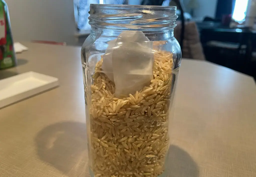 A jar of rice with a hardware wallet inside.